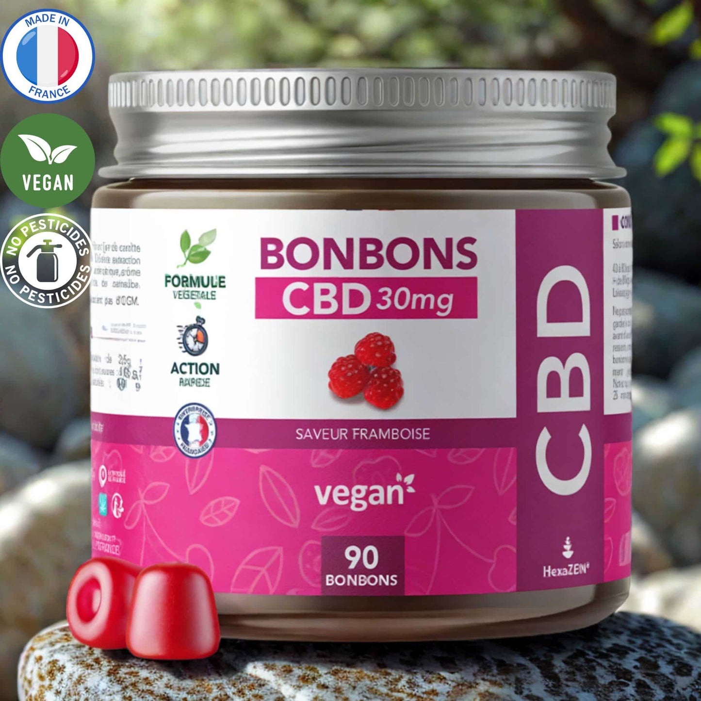 Pot de bonbons CBD 30mg à la framboise, formule végétale. 90 bonbons par pot. Made in France, vegan et sans pesticides. Deux bonbons rouges présentés devant le pot.