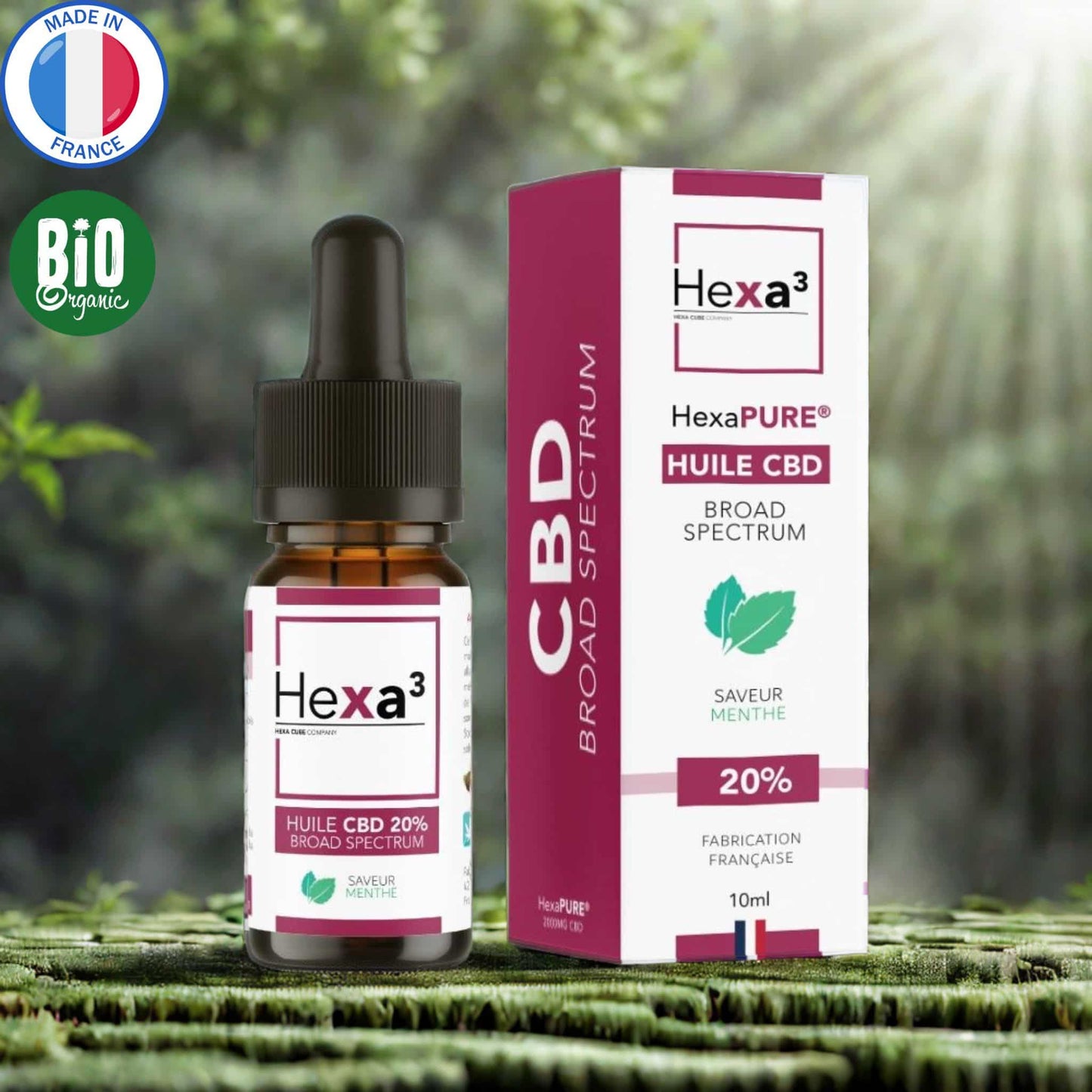 Huile CBD 20% Broad Spectrum saveur menthe : flacon pipette ambré et son packaging blanc et bordeaux avec feuilles de menthe. Made in France, huile MCT bio, 10ml.